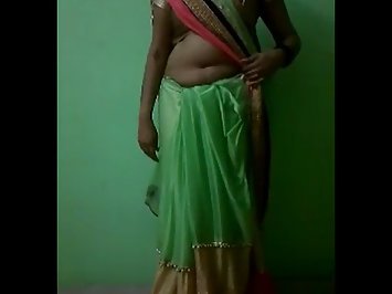Sexy Indian wife stripping her green silk sari